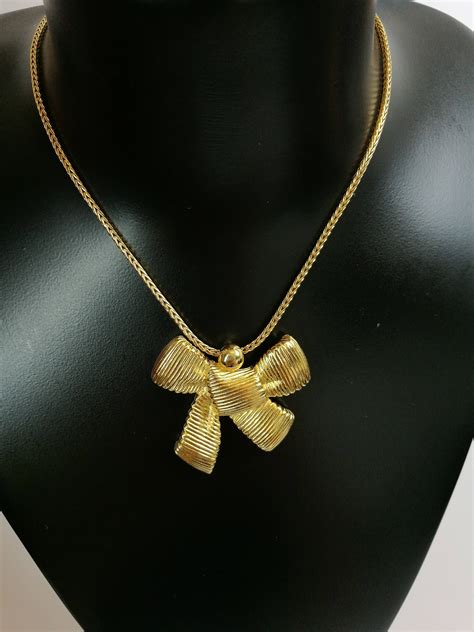 dior bow necklace gold|vintage Dior necklace.